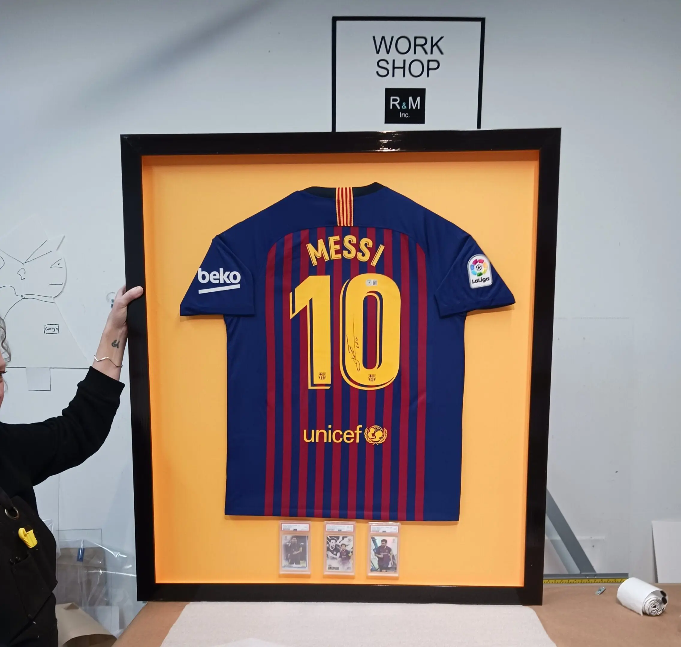 Framed soccer jersey with number 10.