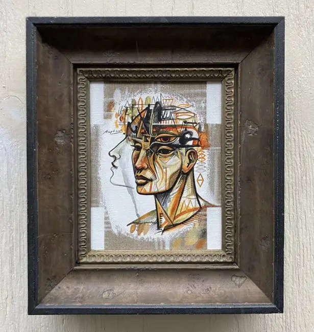 Framed abstract portrait with geometric elements.