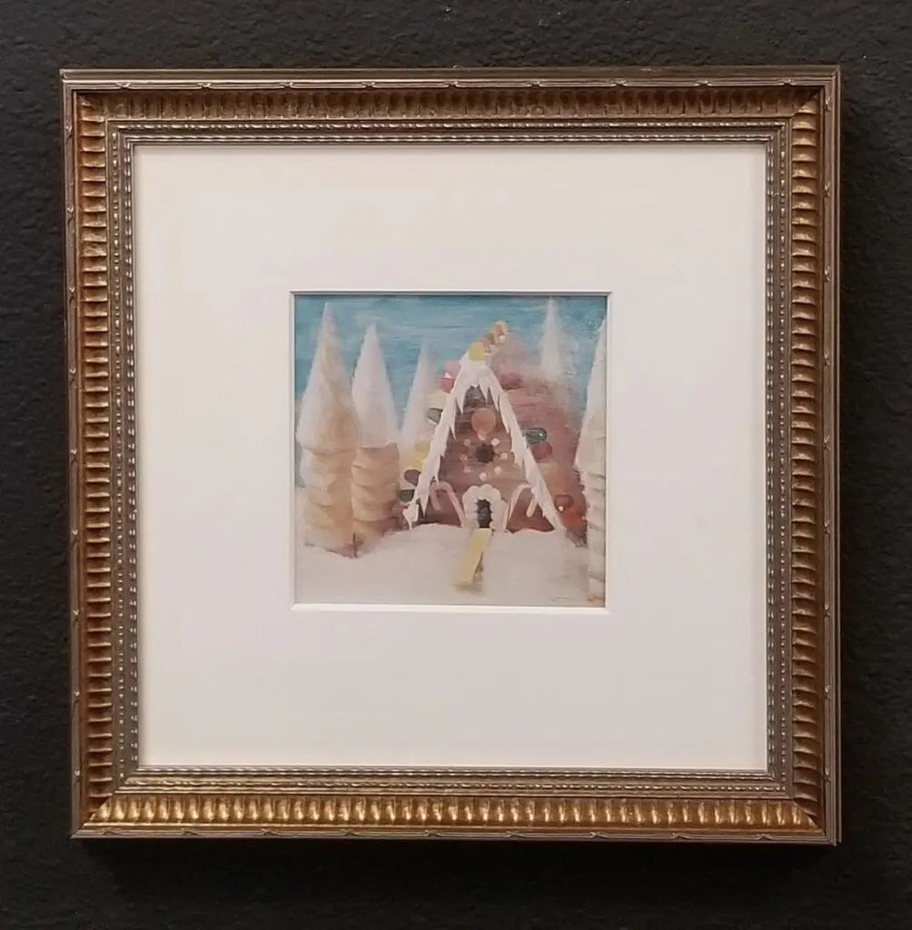 Framed painting of a whimsical gingerbread house.