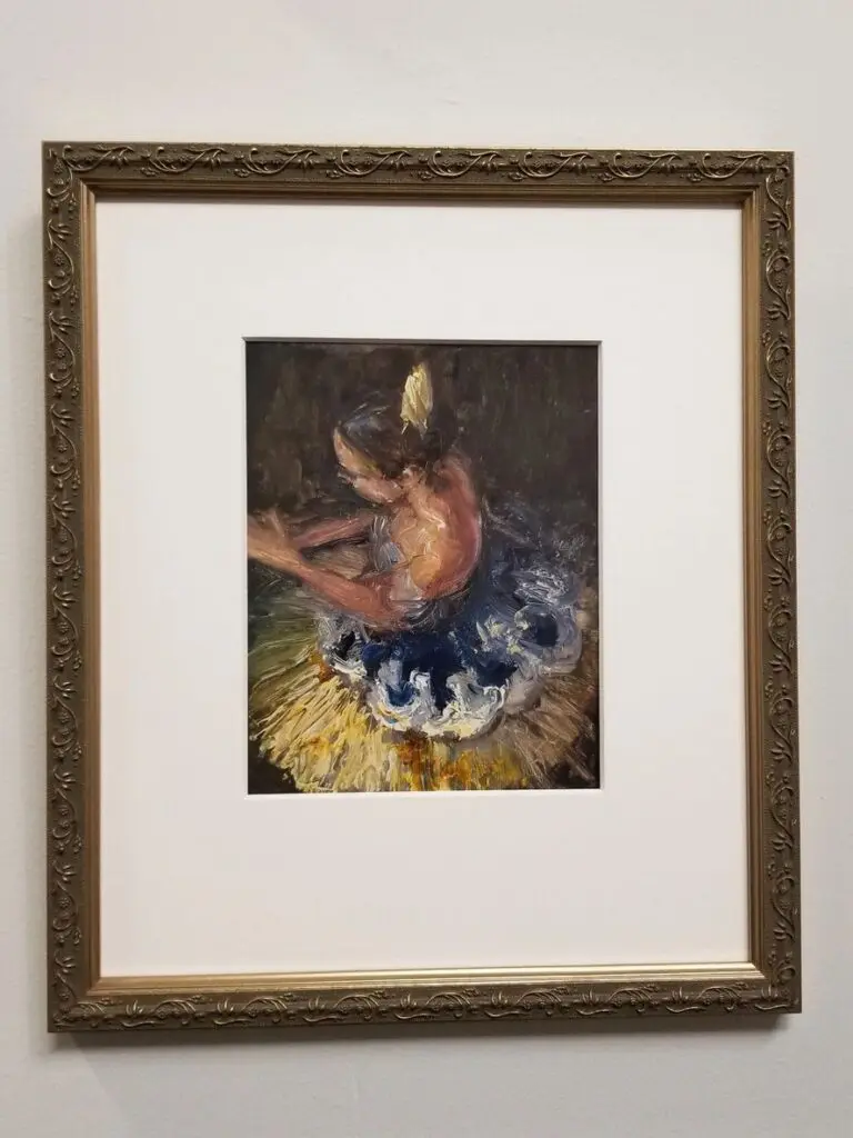 Framed painting of a ballerina in costume.
